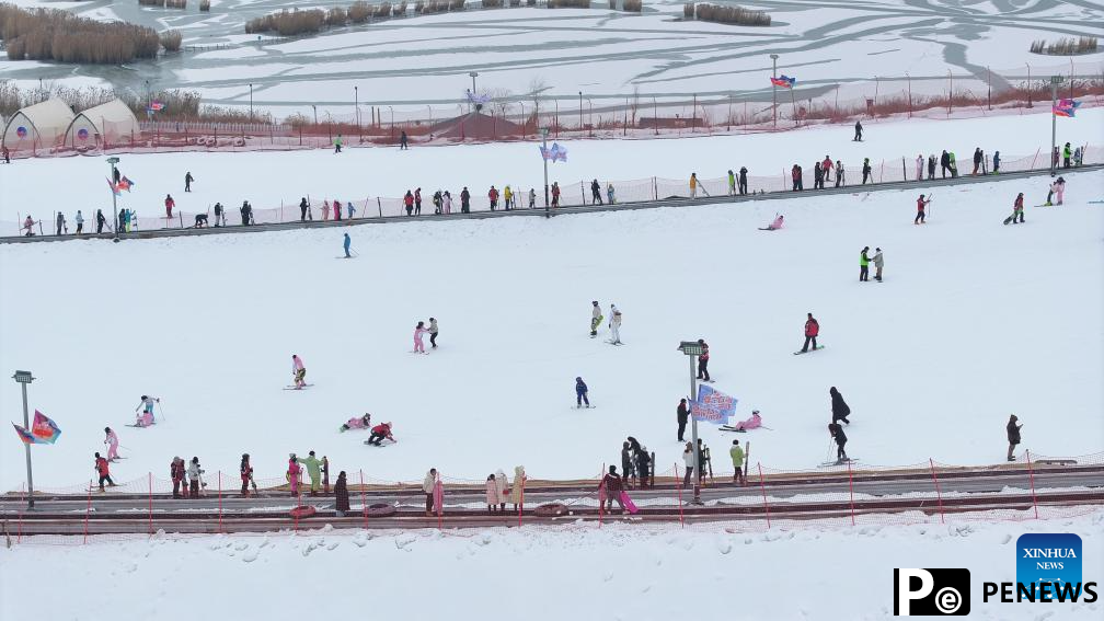 Tourists ski at Yuehai Ski Resort in Yinchuan, China