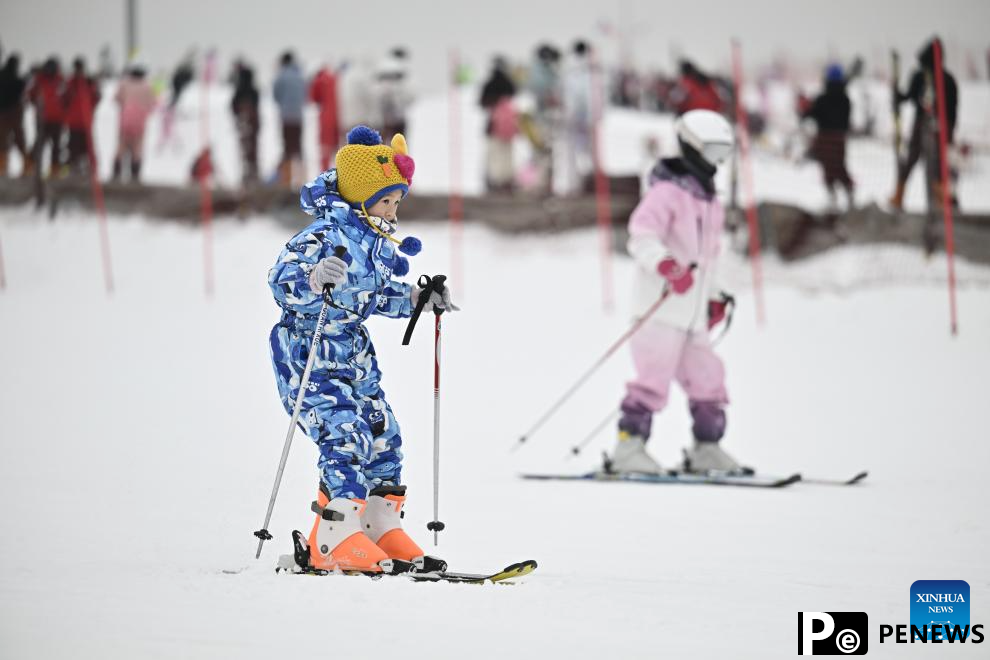 Tourists ski at Yuehai Ski Resort in Yinchuan, China
