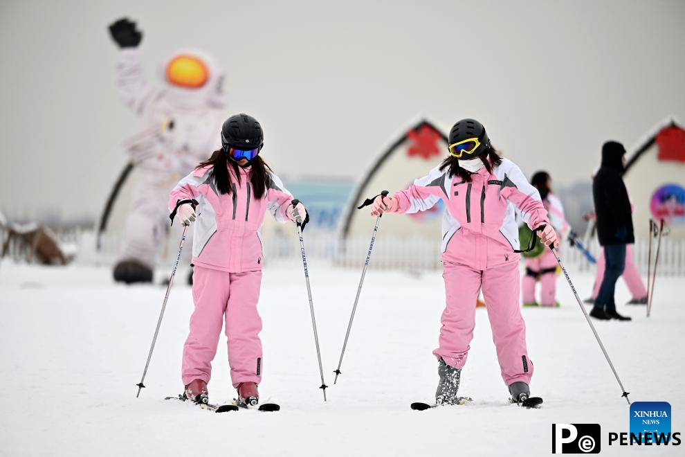 Tourists ski at Yuehai Ski Resort in Yinchuan, China