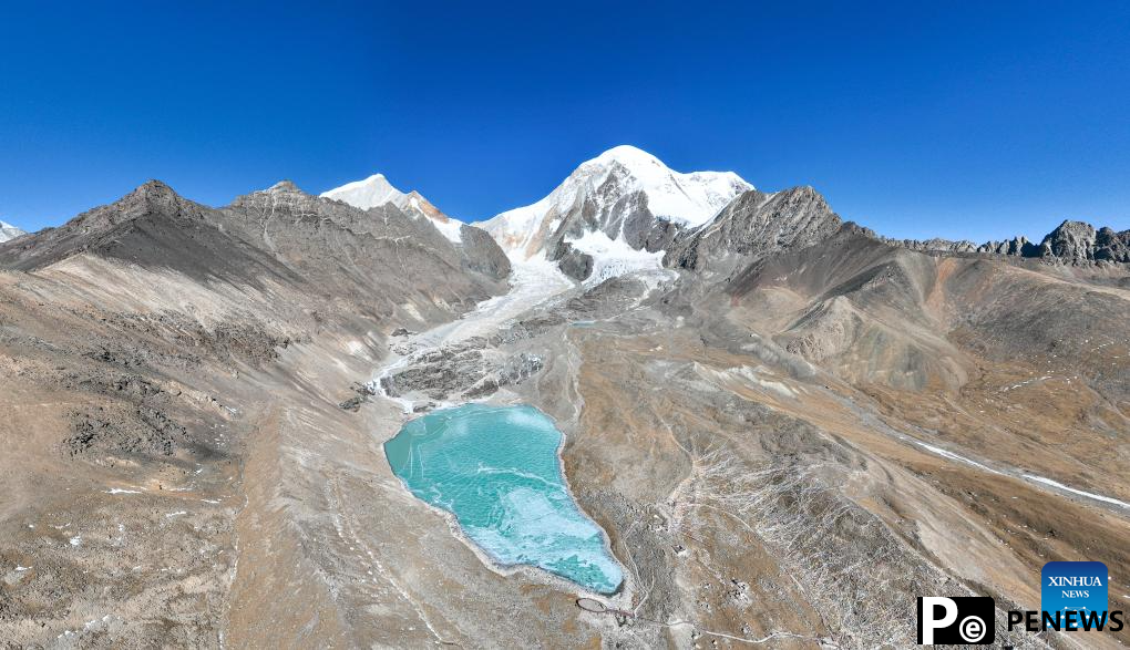 Tourists have fun on icy lake in Lhasa, China