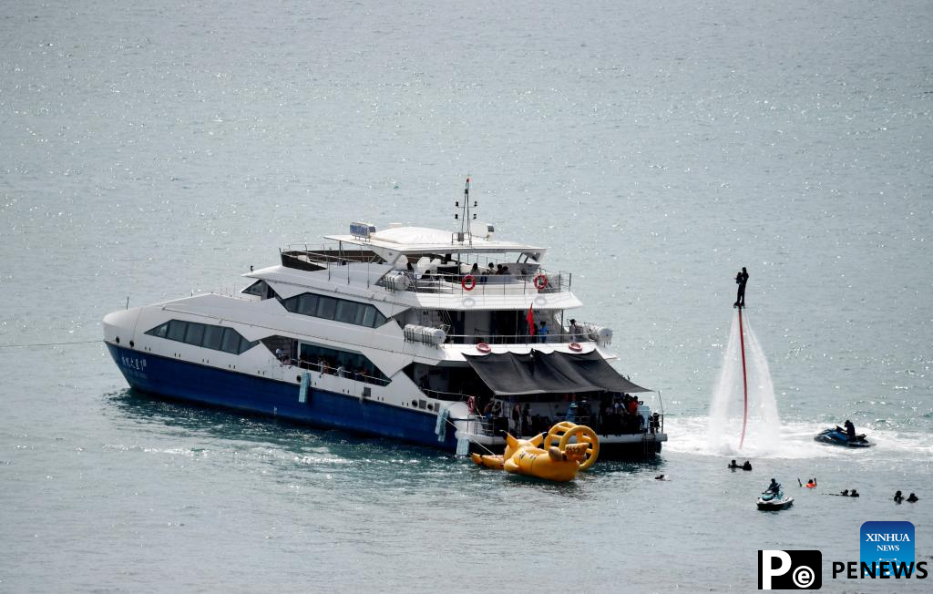 Tourists take yachts to have fun in Sanya, China