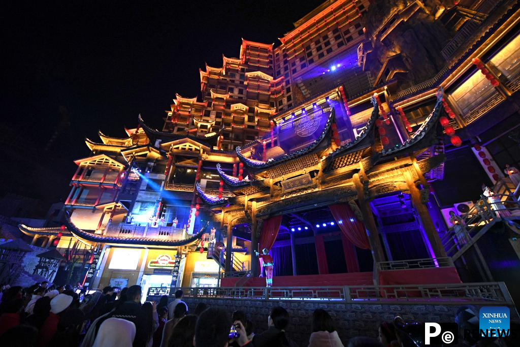 Tourists visit scenic spot noted for splendid building in Zhangjiajie, C China