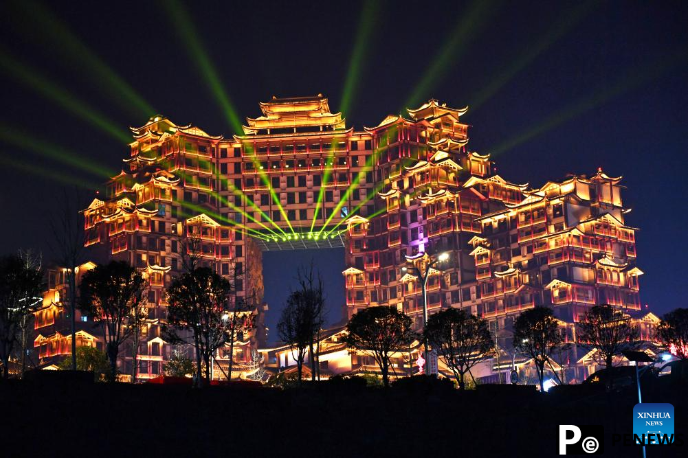 Tourists visit scenic spot noted for splendid building in Zhangjiajie, C China