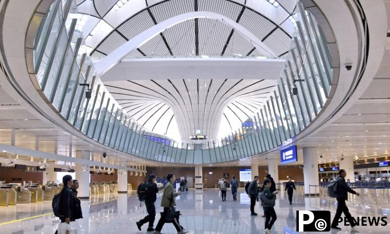 Foreign tourists go through customs at the Beijing Daxing International Airport in Beijing, capital of China, Dec. 27, 2024. On Dec. 17, China announced a significant relaxation of its visa-free transit policy, extending the permitted stay for eligible foreign travelers from the initial 72 hours and subsequent 144 hours to 240 hours, or 10 days.China recorded nearly 29.22 million inbound foreign visits between January and November 2024, up 86.2 percent year on year. Of these, 17.45 million entered the country visa-free, marking a significant 123.3 percent year-on-year growth. (Xinhua/Ju Huanzong)