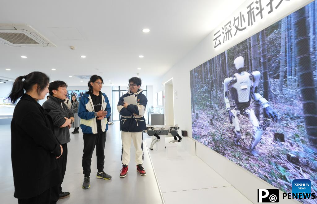 Young engineer enchanted with robotics in Hangzhou