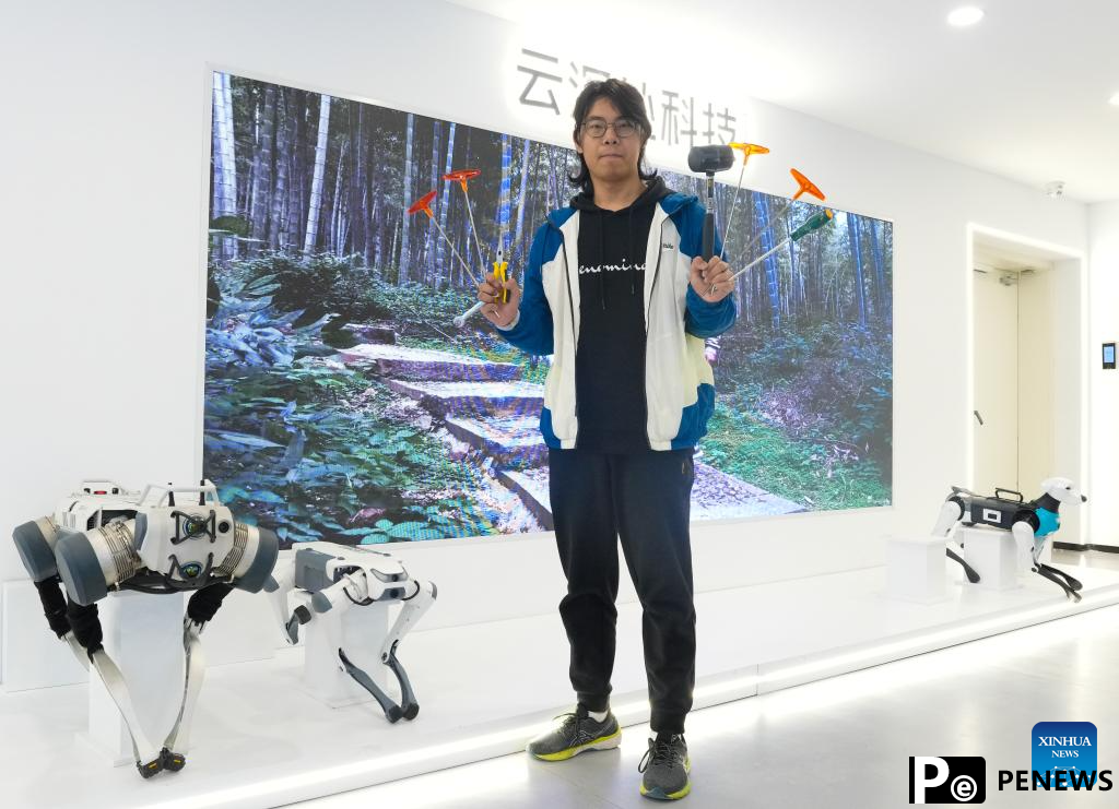 Young engineer enchanted with robotics in Hangzhou