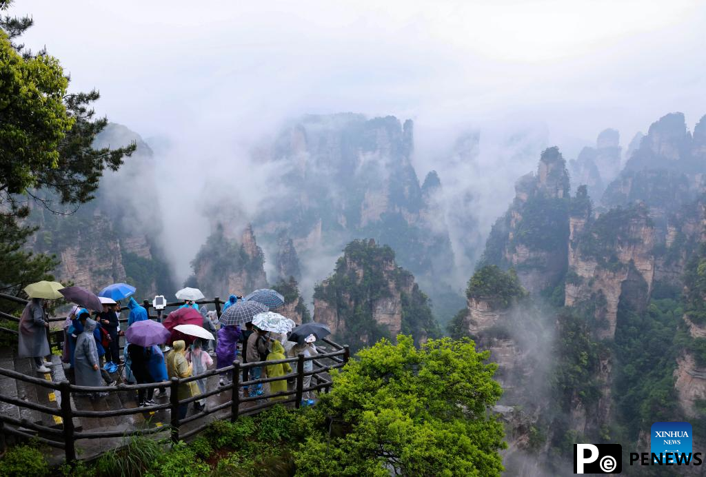 Tourists visit Zhangjiajie National Forest Park in China