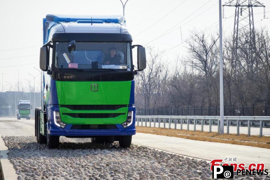 powered heavy trucks roll off production line