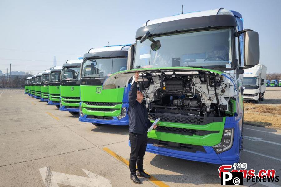 powered heavy trucks roll off production line