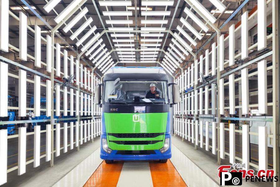 powered heavy trucks roll off production line