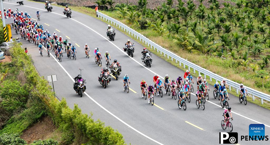 Cyclists compete during Stage 2 at 16th Tour of Hainan cycling race