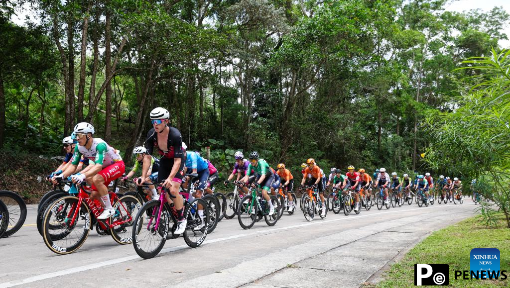 Cyclists compete during Stage 2 at 16th Tour of Hainan cycling race