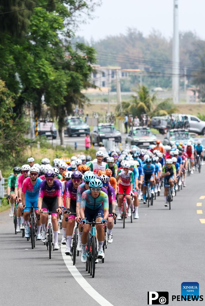 Cyclists compete during Stage 2 at 16th Tour of Hainan cycling race