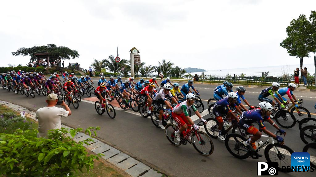 Cyclists compete during Stage 2 at 16th Tour of Hainan cycling race