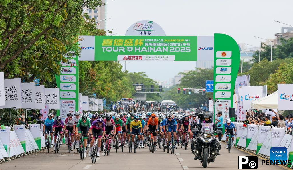 Cyclists compete during Stage 2 at 16th Tour of Hainan cycling race