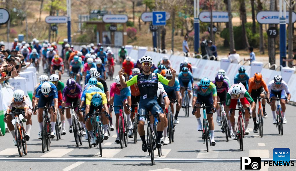 Cyclists compete during Stage 2 at 16th Tour of Hainan cycling race
