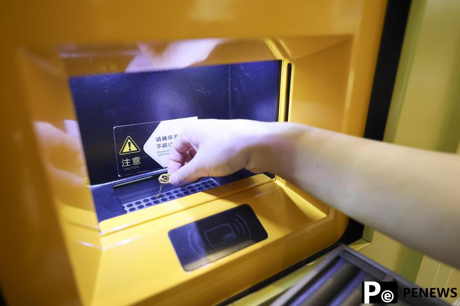 In pics: Smart gold store debuts in Shanghai